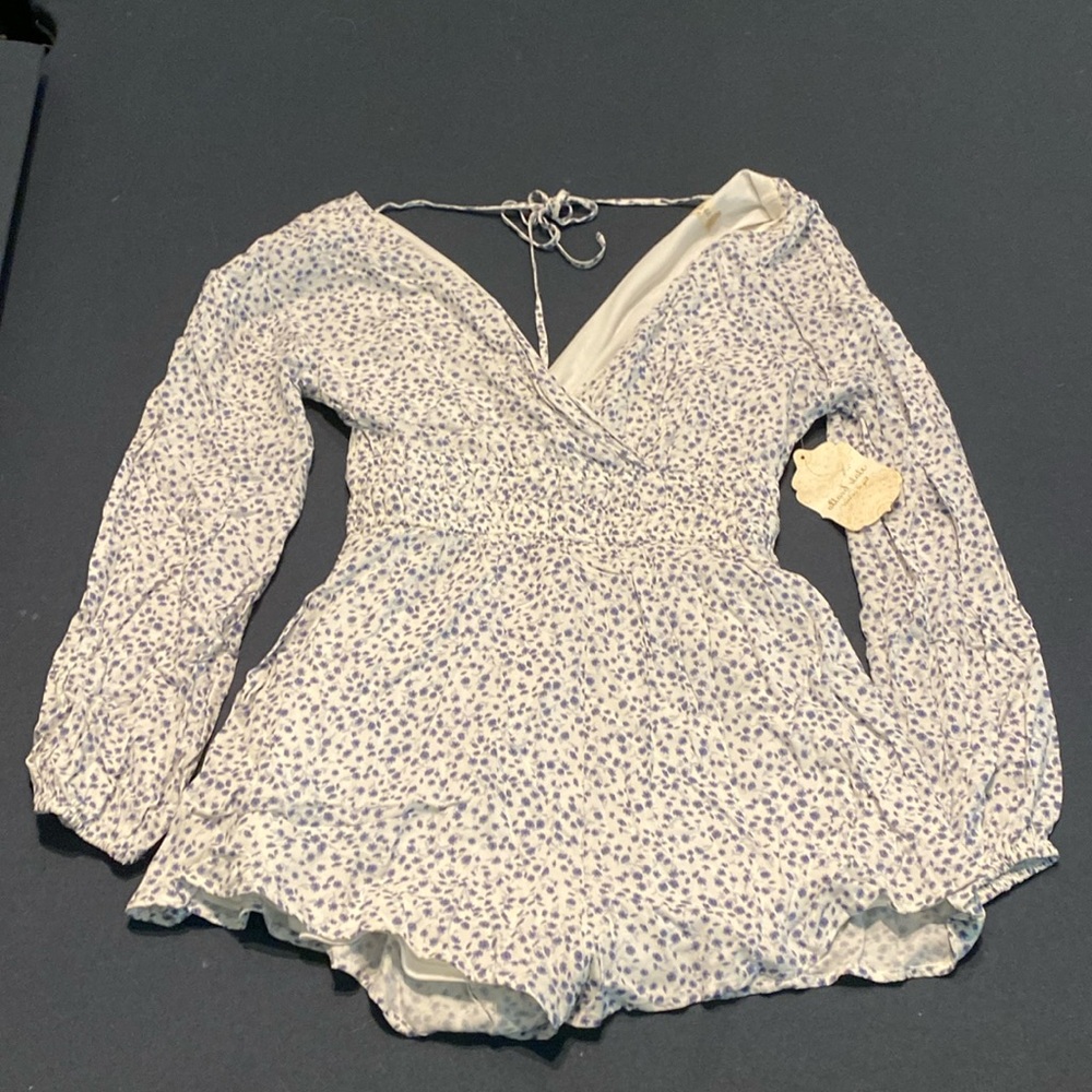 Blue and white floral print romper from Altar’d State